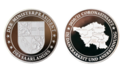 Vorder- und Rückansicht der Münzen zum Dank und zur Anerkennung mit Prägung der Landeskarte Saarland